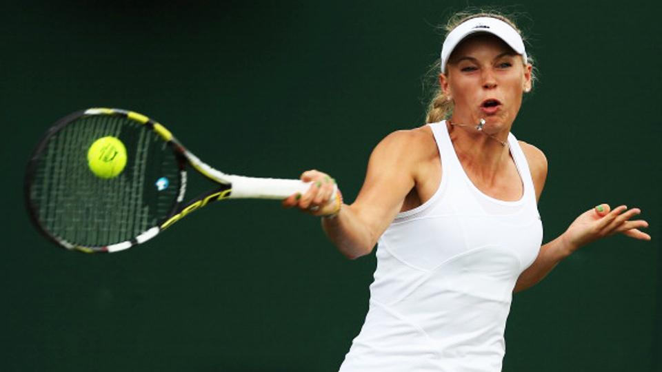 Caroline Wozniacki petik kemenangan di babak pertama Wimbledon 2014, Selasa (24/06/14). - INDOSPORT
